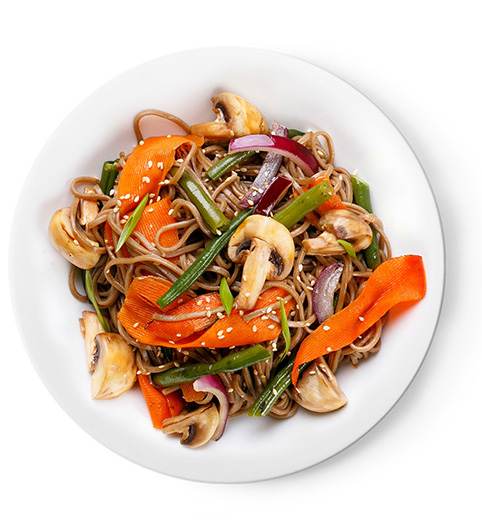 Brown rice noodles, mixed stir-fried vegetables, and tofu cubes