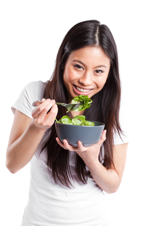 woman laughting with salad
