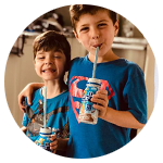 Two young boys drinking PediaSure Complete