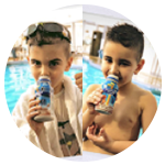 Two young boys drinking PediaSure Complete after swimming