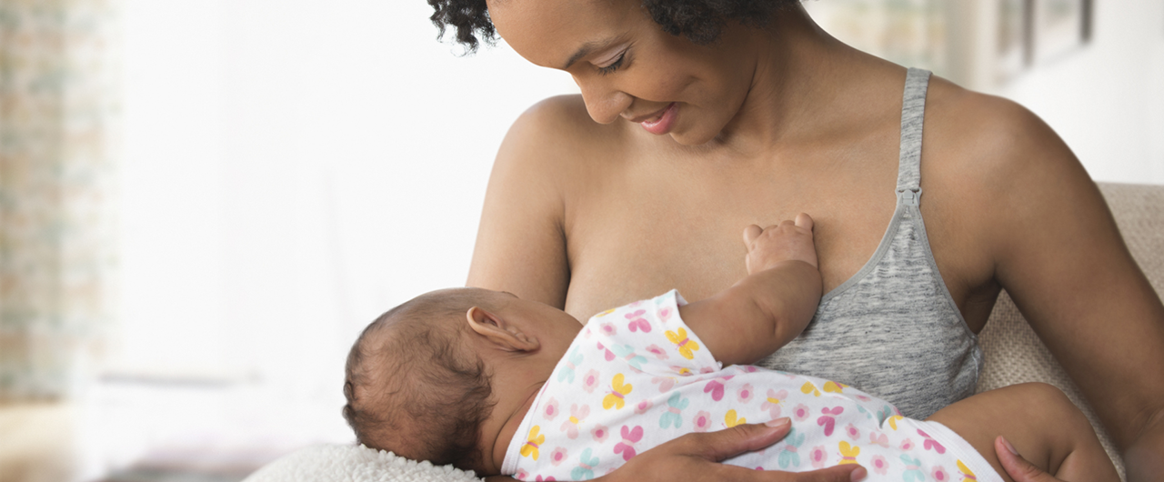 Photograph of a woman breastfeeding a baby