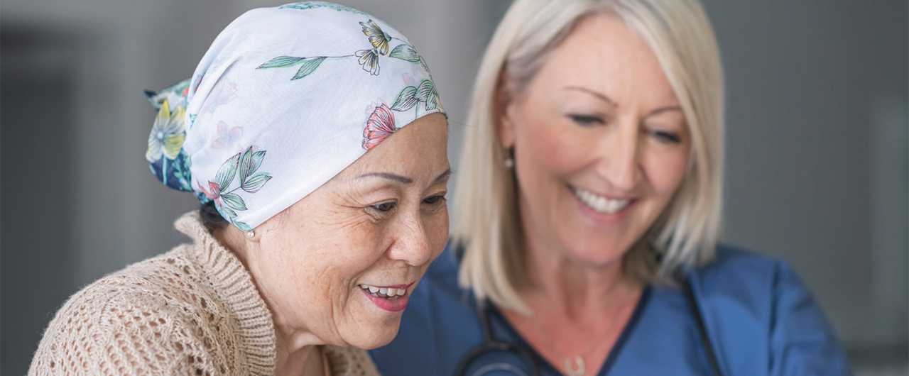 A cancer patient is meeting with a healthcare professional.