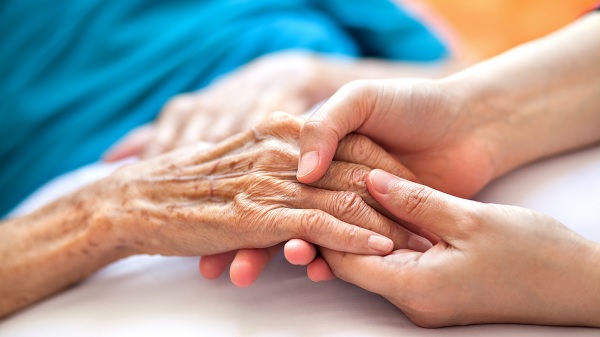 Hand of malnourished hospitalized patient