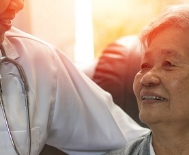 Physician smiles at older female patient
