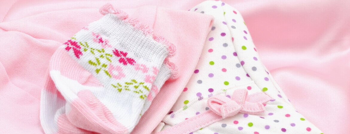 banner-pile-of-pink-baby-clothe