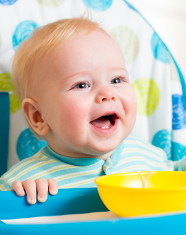 banner-smiling-baby-eating-food