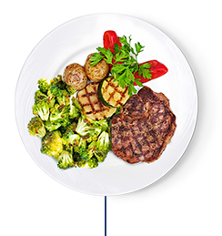 Roasted broccoli, zucchini, grilled steak, and roasted potatoes