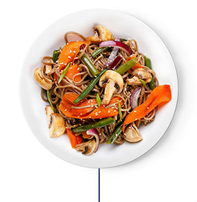 Brown rice noodles, mixed stir-fried vegetables, and tofu cubes