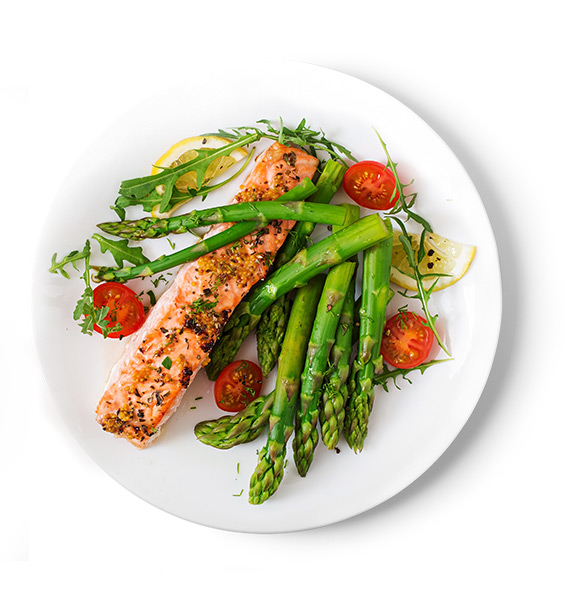 A plate of roasted salmon with cherry tomatoes and asparagus