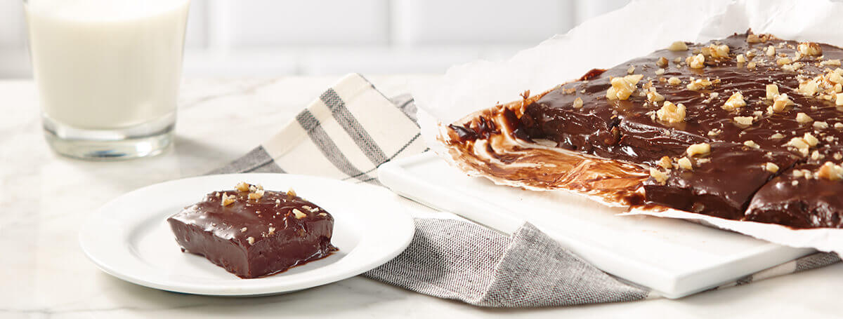 Ensure® Plus Calories easy chocolate fudge recipe with walnuts on top