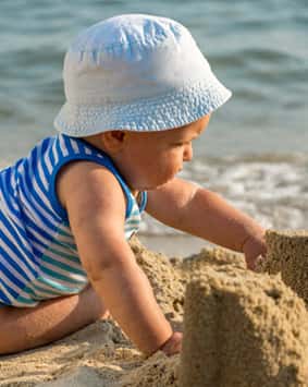 banner-baby-boy-playing-on-the-beach - Copy