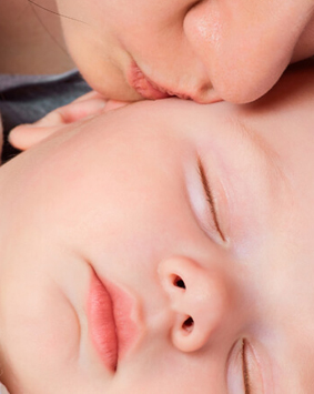 banner-mother-kissing-sleeping-baby-son - Copy