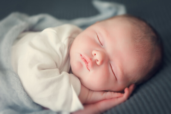 sleeping-newborn-baby-in-a-wrap
