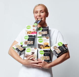 Allie Long holding boxes of ZonePerfect Macros and Classic bars